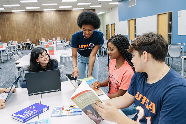 UTSA University College students working together around a table